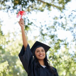 Cropped shot of an attractive young female graduate posing outside with her degree