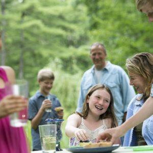 Organic Farm. An outdoor family party and picnic. Adults and children.